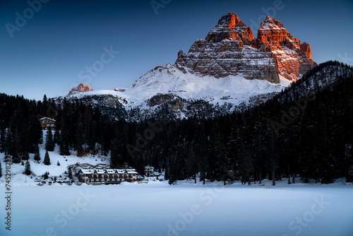 The most famous peaks of the Dolomites in the first rays of the sun. Tre Cime di Lavaredo, near Cortina d'Ampezzo.