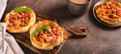 Chicago pizza pot pie with sausage, tomatoes and cheese on a board on the table web banner