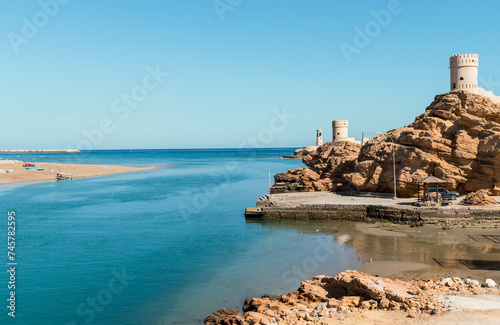 Landscape of the bay of Sur with Al Ayjah Lighthouse and fort on the rock, Sultanate of Oman in the Middle East.