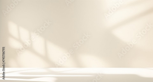 Minimalistic abstract simple gentle light beige background for product presentation with light and beautiful shadow from window on wall.