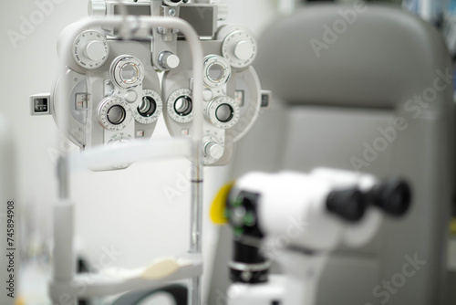 close up of phoropter, specialized instrument used in eye examinations to measure refractive errors and determine eyeglass prescriptions, eye medical clinic