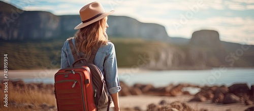 Independent Traveler Devising Adventure Plans with Bold Red Suitcase in Hand
