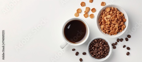 A photo showcasing a couple of cups of coffee sitting next to bowls filled with granola on a clean white background.