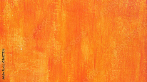 Orange Pinselstriche mit Struktur auf einer Wand als Hintergrund