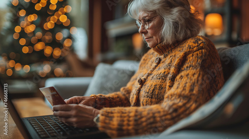 The danger of scammers tricking elderly people into filling out credit cards, Elderly people shopping online, Elderly person holding a credit card.