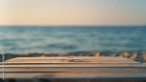 Minimalist Wooden Tabletop at Sunset with Blurred Ocean Background