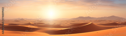 The shimmering sand reflecting the sun's rays in the middle of the desert