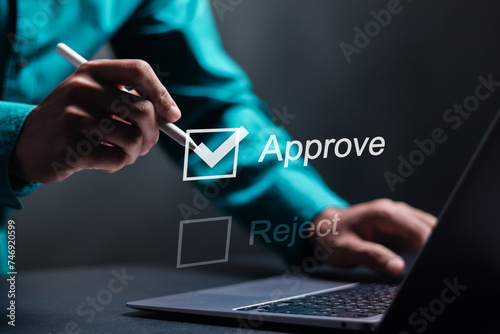 Option to approve or reject. Businessman tick a checkbox with the text approve. Deciding between approve or rejecting for business project.