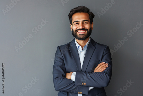 Smiling happy young indian business man