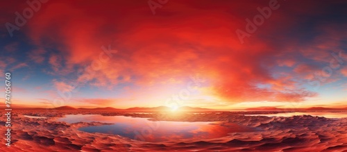 A seamless spherical panorama showcasing a glowing golden red sunset over a calm body of water. The sky is painted with vibrant hues, reflecting beautifully on the tranquil water below.
