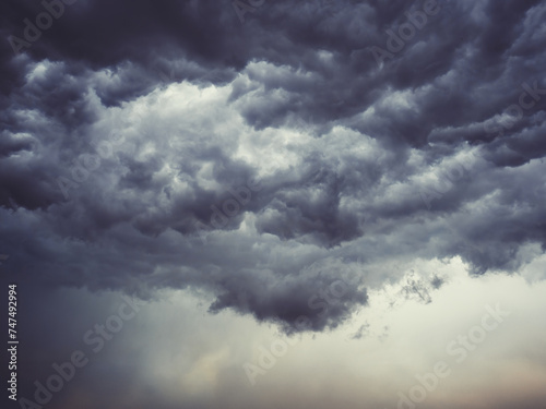 Dramatic blue sky with clouds. Spooky abstract background pattern texture. Horror, Halloween, evil, armagedon, apocalypse concept.
