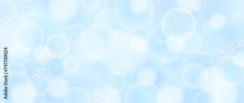 Abstract circle bokeh wallpaper. Smooth soft blue blur effect background. Shiny blurry light sparkles texture. Seasonal backdrop for Christmas, New Year or birthday card, poster, banner. Vector