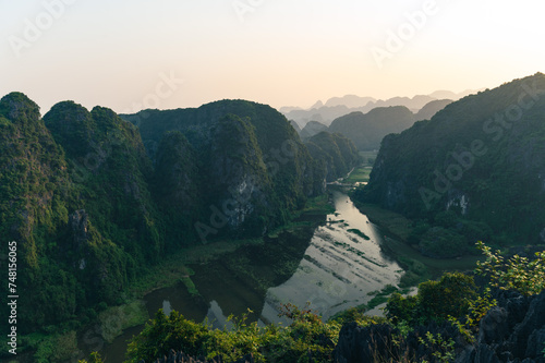 Viewpoint Đầm sen Hang múa is a popular spot for tourists visiting Tam Coc in the Ninh Binh region of Vietnam. In the background are the mountains and rice fields of the region.