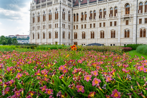 Hungarian Parliament building and flower garden in Budapest. Hungary.