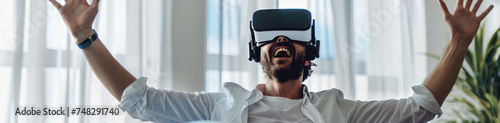 An ecstatic man wearing a VR headset celebrates a moment of virtual triumph, perfect for showcasing gaming victory, educational breakthroughs, or the euphoria of immersive experiences.