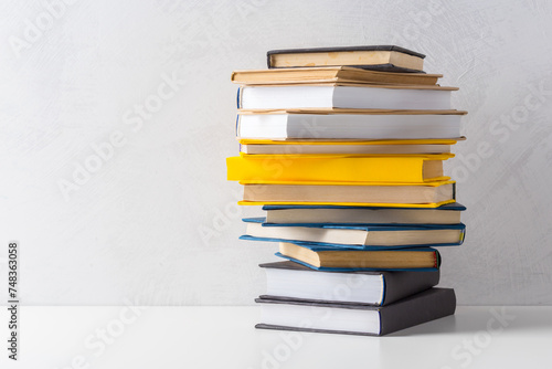  pile of paperback books on a table