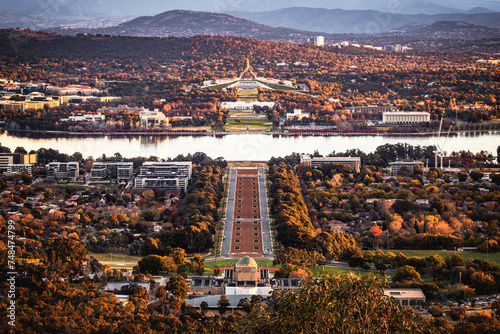 A panorama view of the Parliament House and the city of Canberra from Mount Ainslie Lookout in the dusk in autumn
