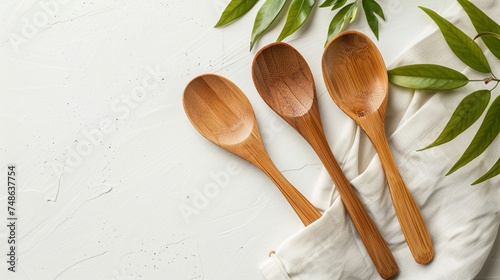Handcrafted bamboo spoon set on a plain white background, blending natural beauty with functional design.