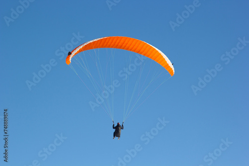 Paragliding. Paragliding in Auvergne. paragliding flight in the mountains in France. Paragliding over the clouds. Sea of clouds and paraglider. Panorama of the mountains. Puy de Dôme. Parapente.