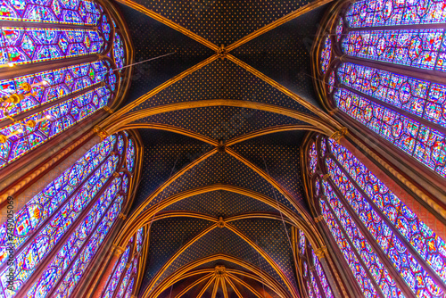 Paris, France - Dec. 27 2022: The stunning stained glass window and the beautiful ceiling in Saint-Chapelle in Paris