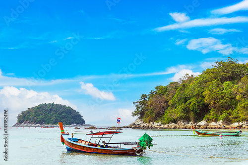 Kata beach with boat and blue sky in Phuket Thailand