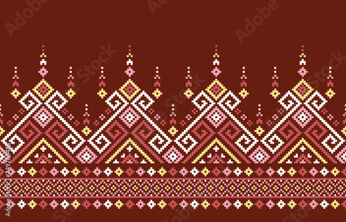 Ethnic pattern features a captivating mix of geometric shapes and stylized floral motifs on a brown background. Bold colors create a visually striking and seamless design.