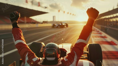 Jubilant racer with fists raised at sunset, celebrating victory on the track.