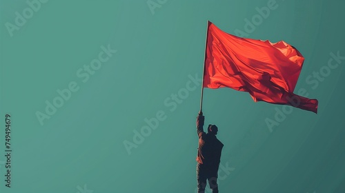 man holding a big red flag visual concept for international labor day
