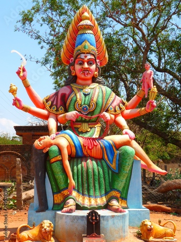 statue of a body with many arms in India