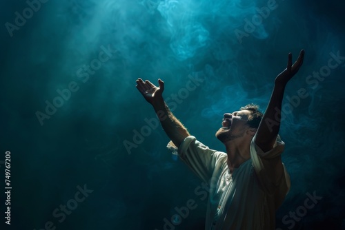 A Christian man praying to God crying and emotional with his arms raised