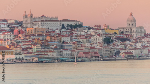Panorama of Lisbon historical center and ferry terminal Terreiro do Paco aerial timelapse during sunset from above. Portugal