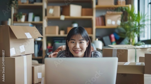 SME entrepreneur Small business entrepreneurs Online selling ideas,Happy Young Asian business owner work on computer and a boxs at home,delivery SME procurement package box deliver to customers,