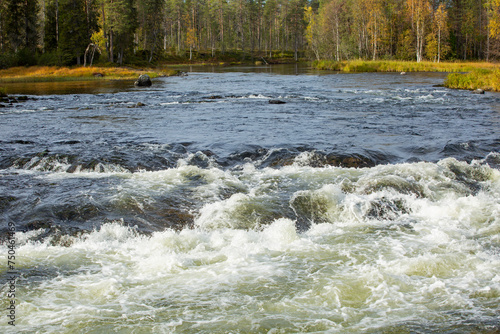 Beautiful autumnal river landscape of Kitkajoki (Kitka river) during autumn foliage in Northern Finland, Europe