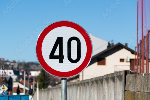 Speed limit 40 sign close up, indicates a road or part of the road on which vehicles may not move at a speed higher than the speed indicated on the sign