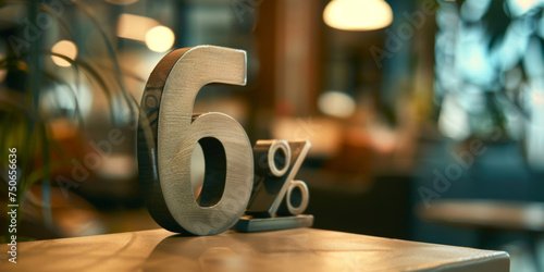 6 percent off. discount number "6%" mede of metalic, on a table, blurred background