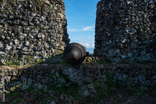 Baubau, Indonesia -March 1, 2024 -The Historic Cannons of the Buton Palace Fort Overlooking the Modern City View