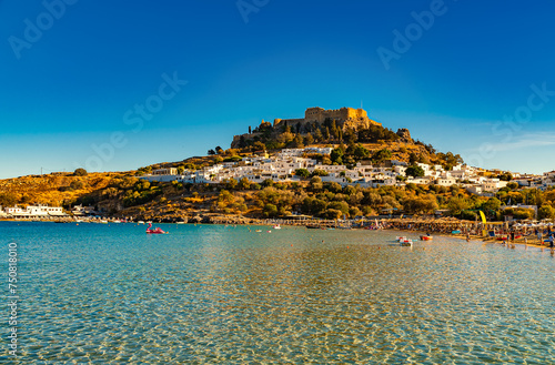 View of the Acropolis of Lindos and the city from the beach.
