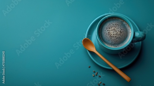 Overhead Shot of Coffee Cup, Spoon, and Beans on Cyan Background: Cafe Branding Resource 