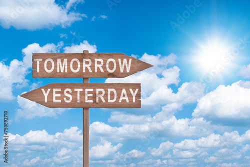 Tomorrow or yesterday road sign on sky background business concept.