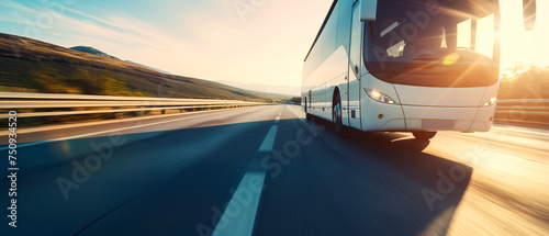 intercity bus traveling at high speed on a picturesque highway at sunrise.