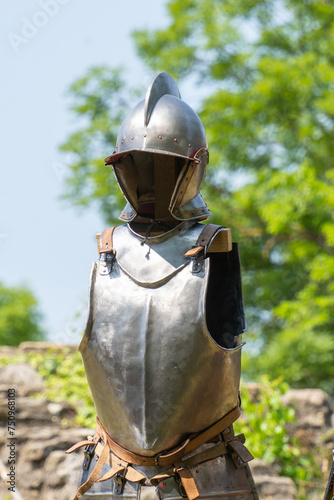 Medieval armor on a stand with breastplate and helmet