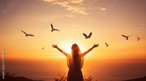 Happy woman with joyful freedom at sunset in summer nature with arms wide open in a flower meadow looking from behind created with Generative AI Technology 
