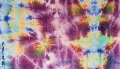 tie dyed pattern on cotton fabric background.