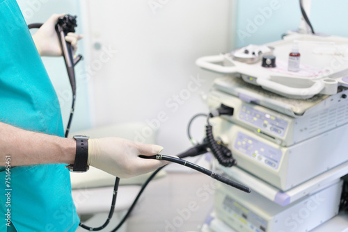 Gastroduodenoscopy distal end and manipulator in the hands of doctors in treatment room