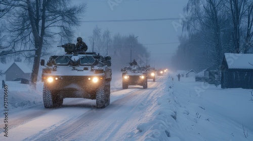 A column of armored personnel carriers riding on a winter road, exemplifying military readiness and strategic winter operation.