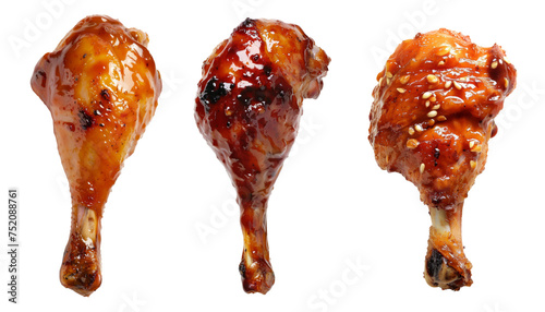 BBQ Grilled chicken drumsticks on a wooden cutting board. Isolated on white background