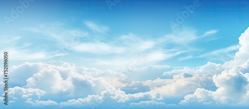 Majestic Plane Soars Across Blue Sky Canvas with Dreamy White Cloud Palette