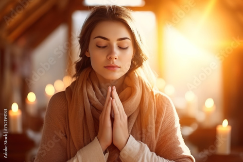 Devout Christian woman is sitting in a church, folding her hands in prayer, seeking guidance and drawing strength from her faith in God and the goodness of Christianity.