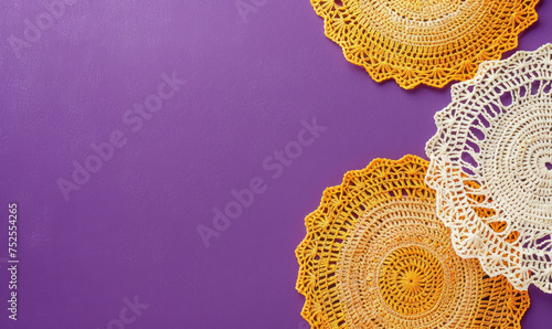 handcrafted crochet doilies on a vibrant purple background with copy space