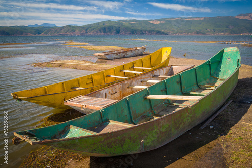 Colorful metal rowing boats at Lashi lake, Yulong, Lijiang, Yunnan province, China